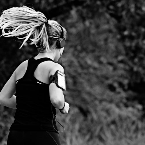 a woman running in the woods